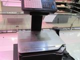 an image of a cash register in a grocery store
