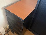 a small desk with a phone on top of it