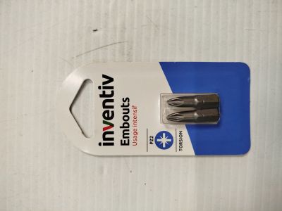 a close up of a small screw in a package on a table