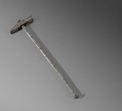 a hammer that is laying on top of a table