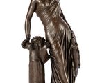 a bronze statue of a woman with a dog on a pedestal