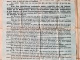 un gros plan sur une feuille de papier sur laquelle figure la photo d'un homme