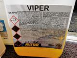 a close up of a bottle of vinegar next to a container of liquid