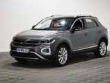 a grey volkswagen suv is parked on a checkered floor