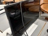 a television that is sitting on a table in a room