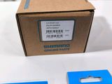 two boxes of shimano genuine parts on a table