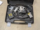 a black case with wires and wires in it on the floor