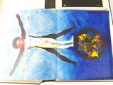 a book with a picture of a man on a cross