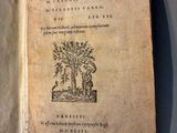 an open book with a picture of a tree on it