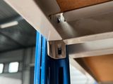 a close up of a shelf with a bunch of plates on it