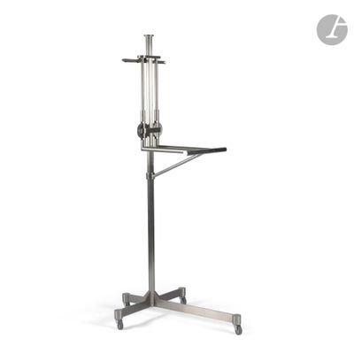 a close up of a metal stand with a glass on it