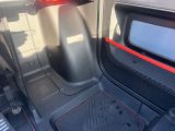 a car with a tv in the back of it ' s trunk
