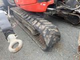 a close up of a tractor that is parked in a lot