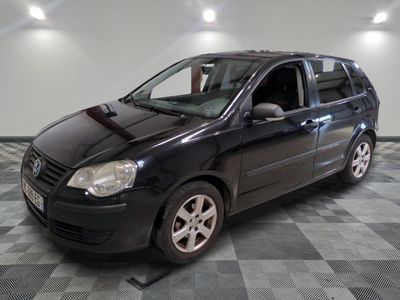a picture of a black car parked in a garage