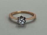 a picture of a diamond ring on a table
