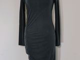 grey dress on a mannequin stand on a white background