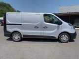 a silver van parked in a parking lot