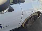 an image of a car that is parked in a parking lot