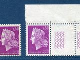 a close up of a stamp with a woman on it