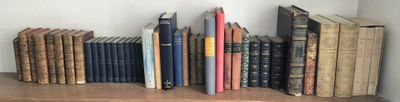a lot of books on a shelf in a room