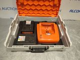 an orange tool case with two batteries in it