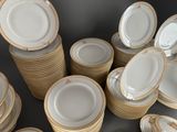 many plates stacked on top of each other on a table