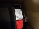 a black and red box with a red handle