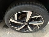 a close up of a tire on a car ' s rim