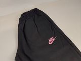 black nike sweatpants with pink nike logo on the side