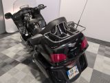 a motorcycle that is parked on a checkered floor