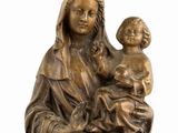 a statue of a woman holding a child in her arms