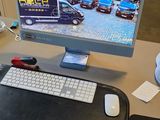 a computer on a desk with a mouse and keyboard