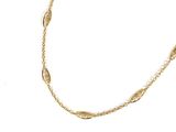 a close up of a gold necklace on a white background