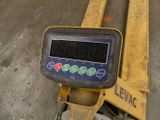 an image of a digital scale sitting on a pallet