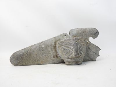 a stone sculpture of a bird on a white background