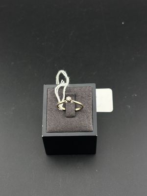 an image of a gold ring on top of a black box