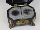 a small box with two coins inside of it