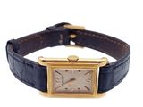 an image of a gold plated wrist watch with a black leather band