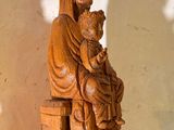 a statue of a woman holding a child on a table