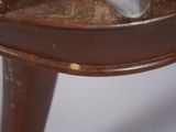 a close up of a wooden table with a knife on it