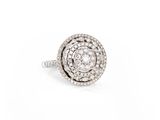 a close up of a diamond ring on a white background