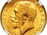a close up of a gold coin with a man ' s face on it