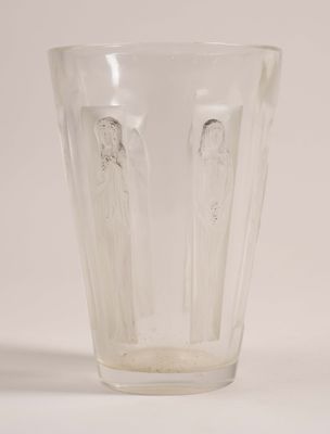 a clear glass cup with two angels on it