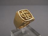 an image of a gold signet ring with a cross on it