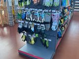 a display of gardening gloves and gloves in a store