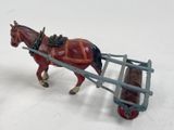 a toy horse pulling a wagon with a man on it