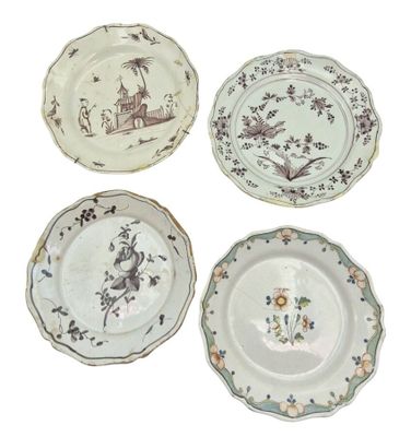 four plates with different designs on them on a white surface