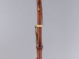 a clarinet with a wooden body and a black top