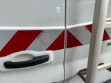 a white van with a red stripe on the side of it