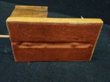 a piece of wood that is sitting on a black surface